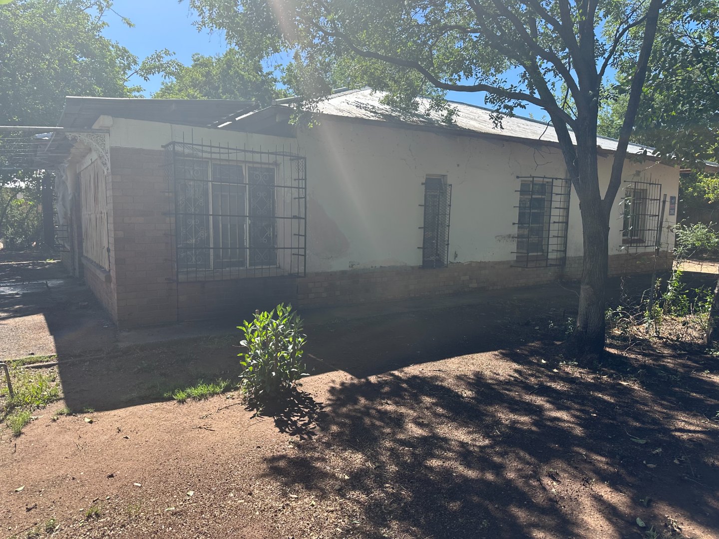 Introducing a fixer up corner house that is in need of TLC… photo 4