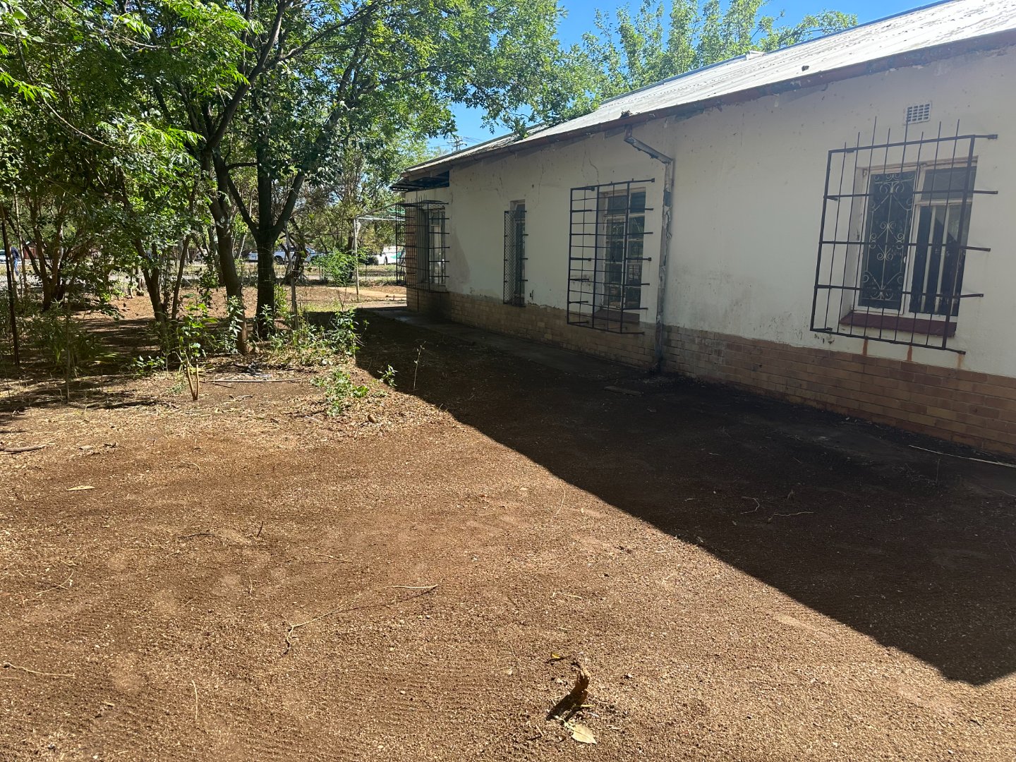 Introducing a fixer up corner house that is in need of TLC… photo 2